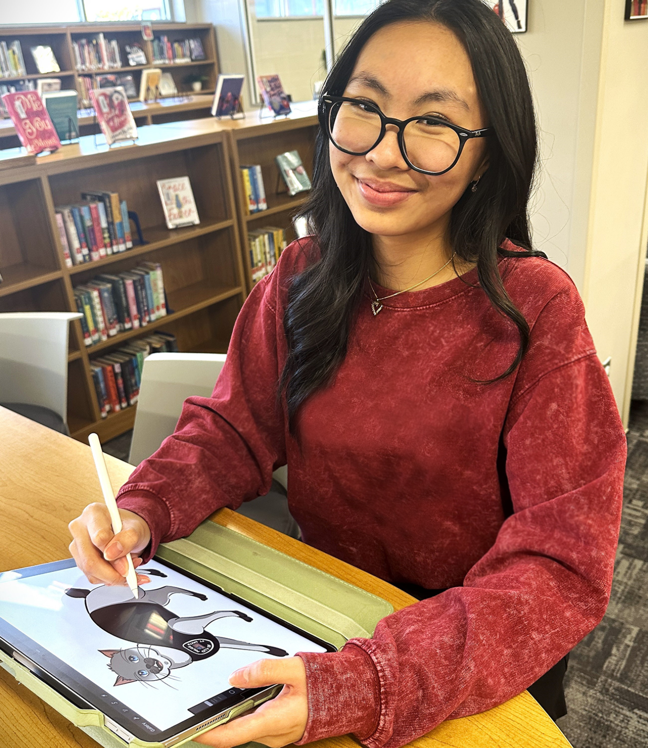 Elizabeth Do in the SHS library